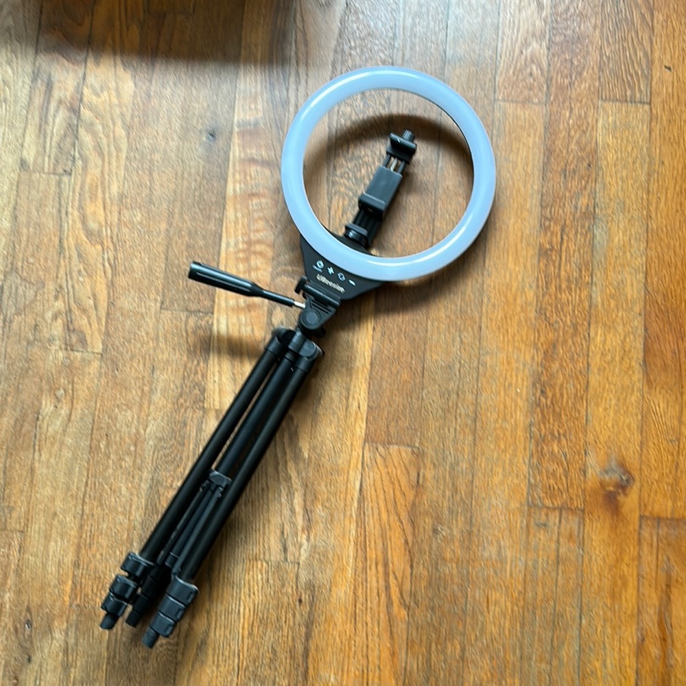 Complete ring light kit with phone mount, tripod, adjustable light levels.
